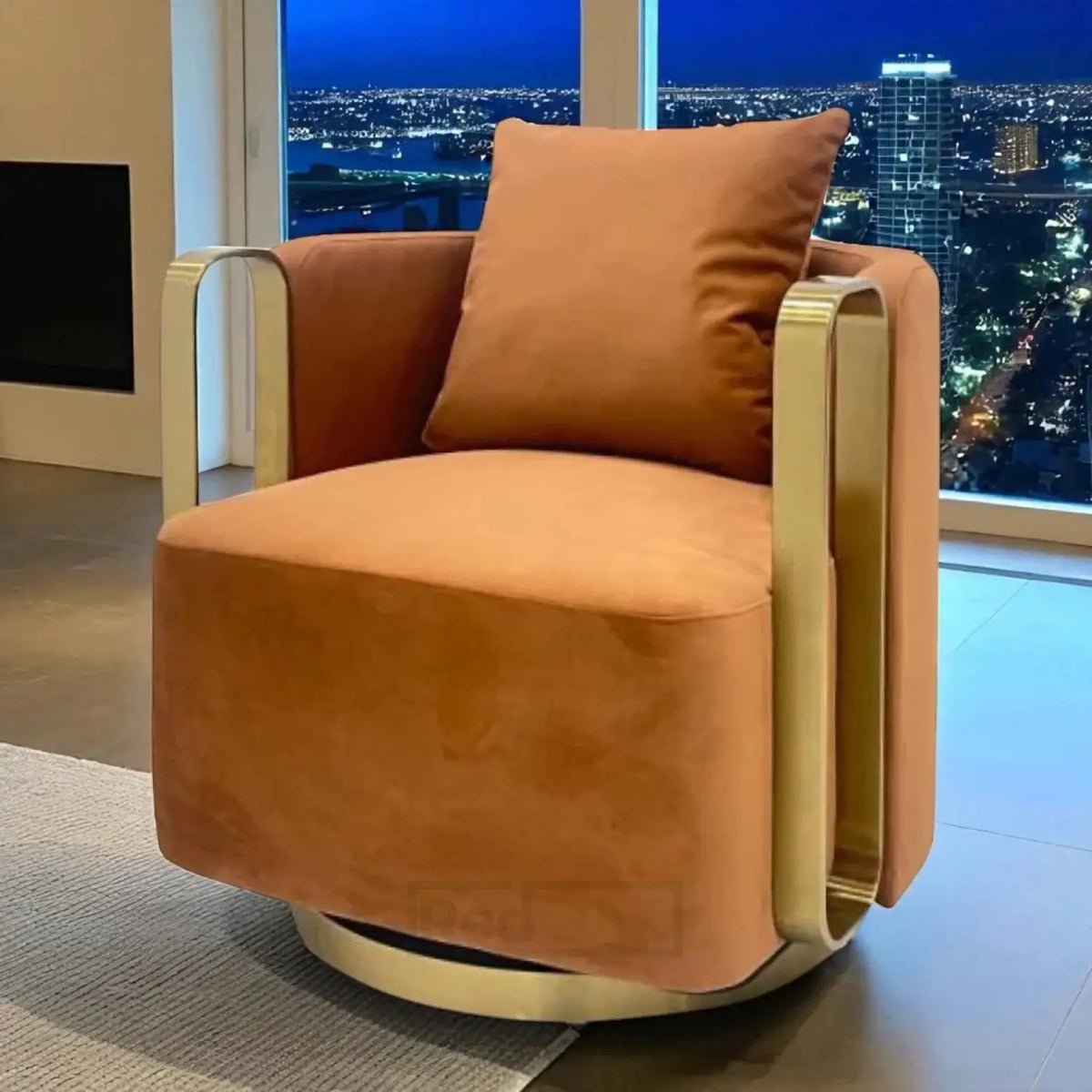 Orange armchair with gold accents in a room with a cityscape view.
