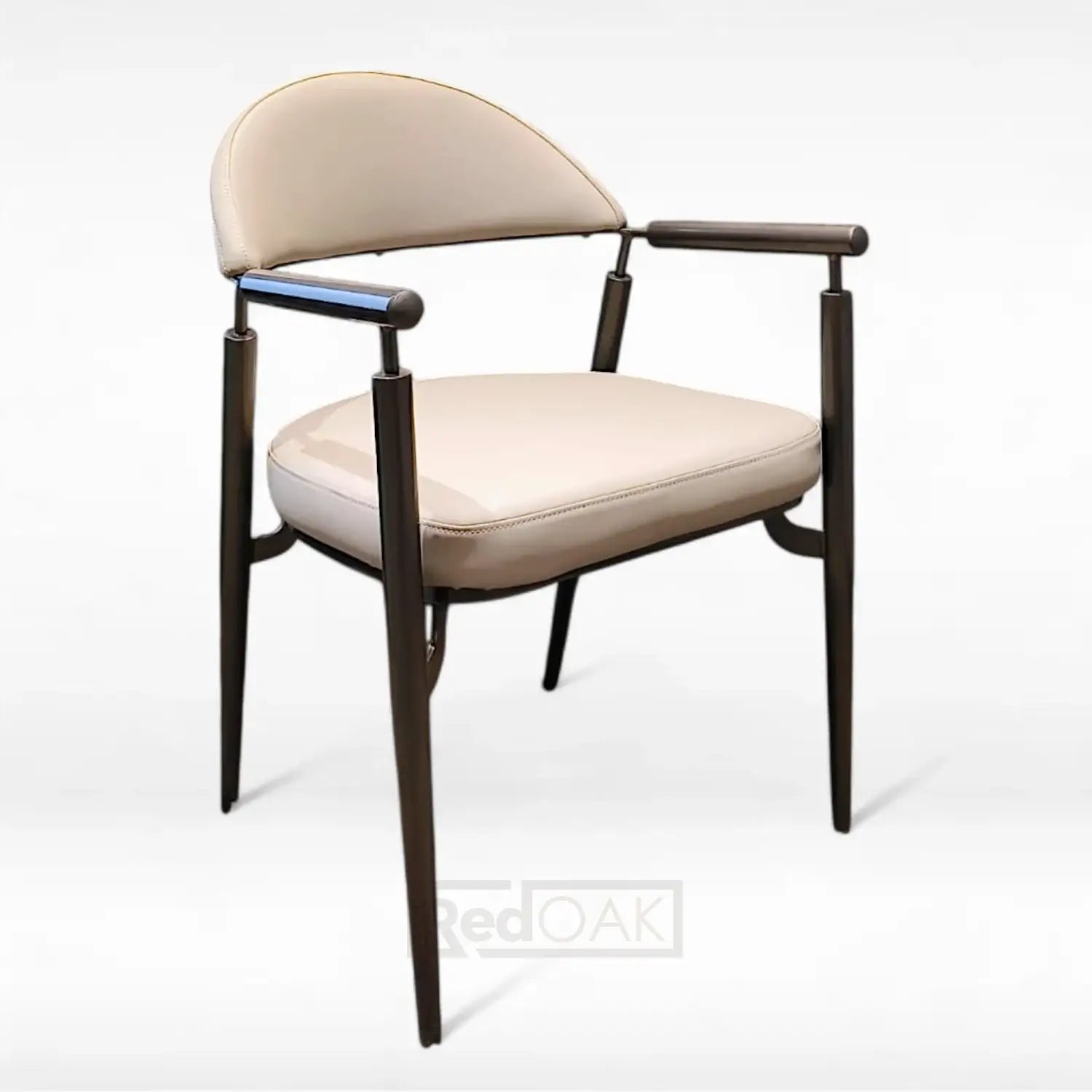 A classic armchair with a vintage design, featuring a beige leatherette upholstered seat and backrest, with gold-colored metal armrests and a curved back frame.