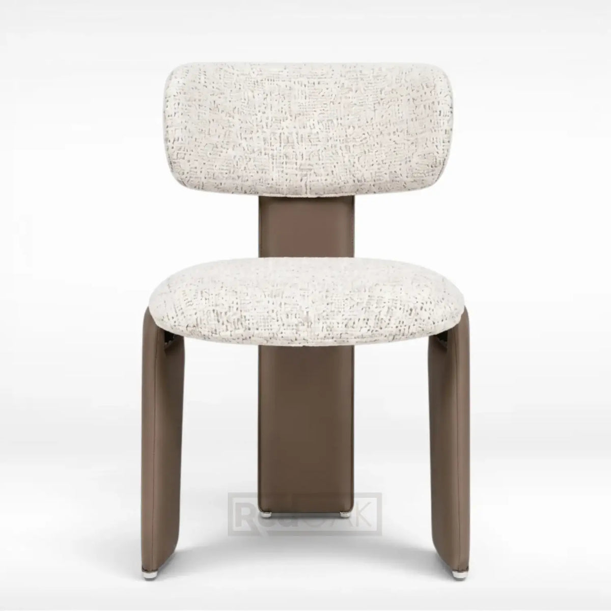 A modern accent chair with a rounded rectangular backrest and seat, upholstered in a textured cream bouclé fabric, supported by a sleek, tapered brown metal frame on a white studio background.