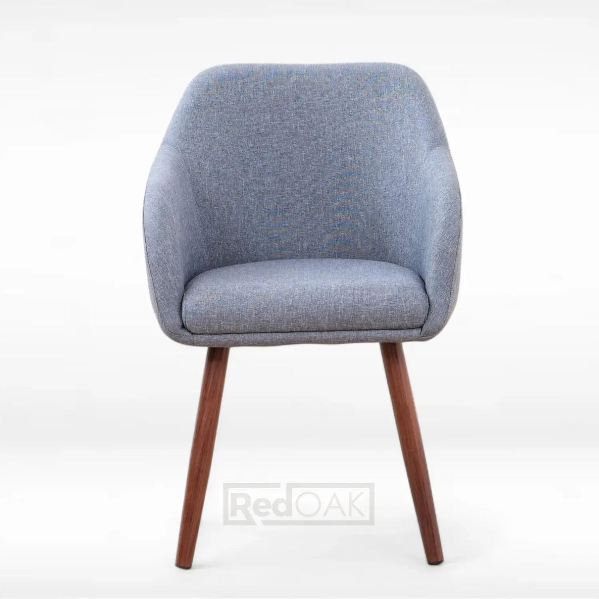 Blue upholstered chair with wooden legs on a white background