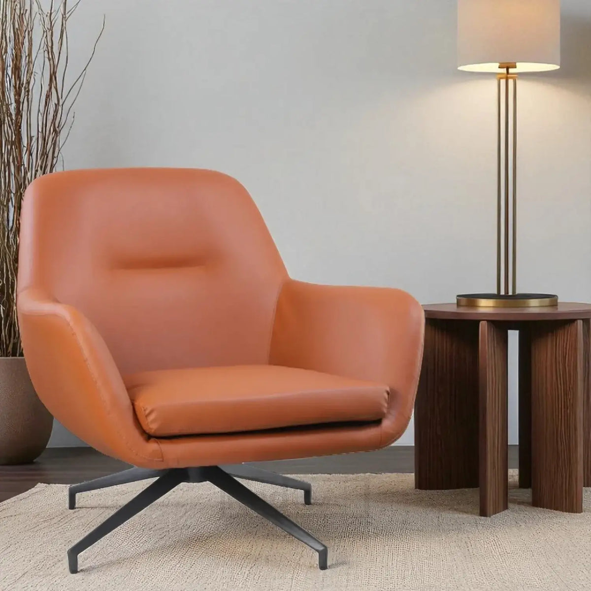 Orange armchair in a modern room with a wooden side table and lamp.