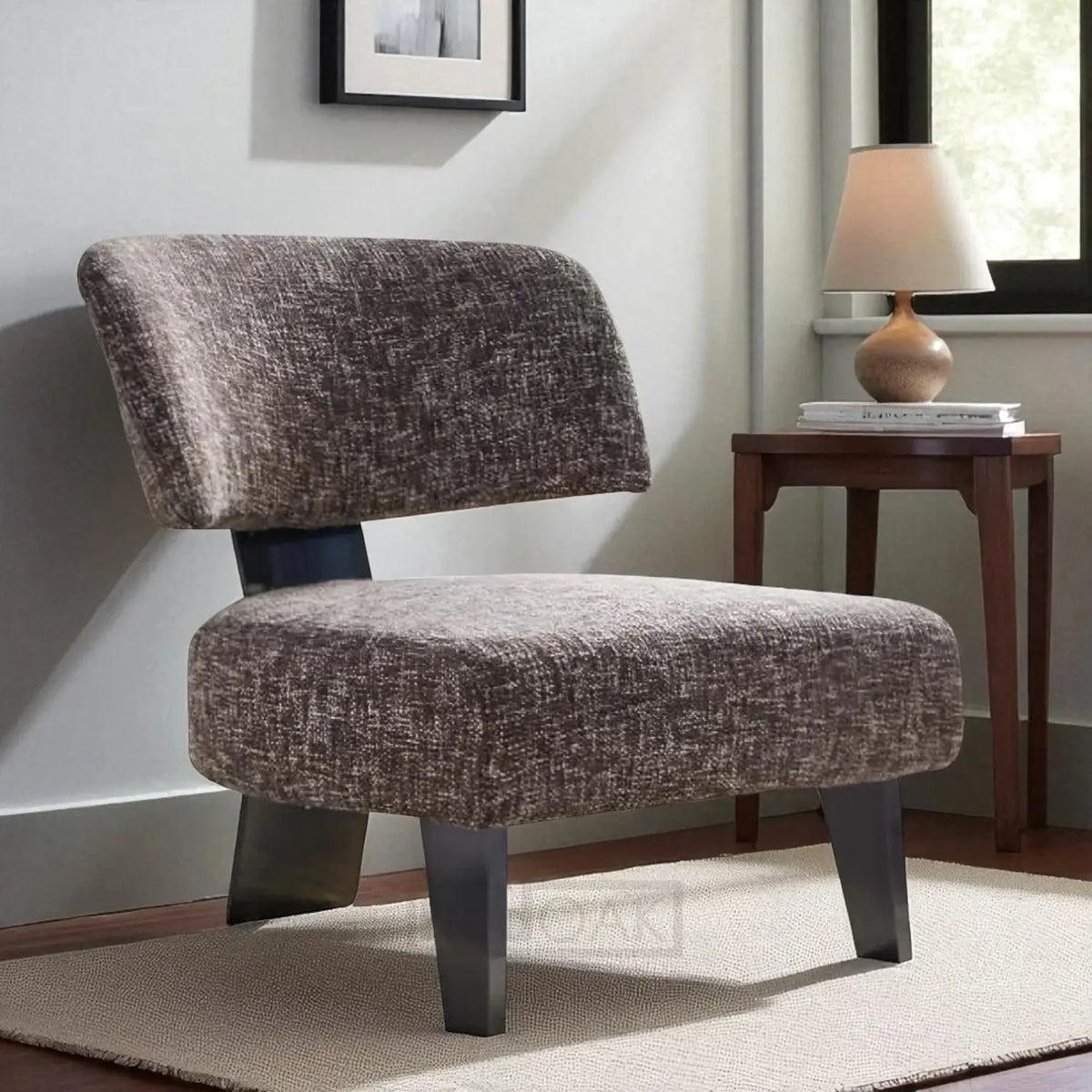 Brown textured chair in a room with a side table and lamp.