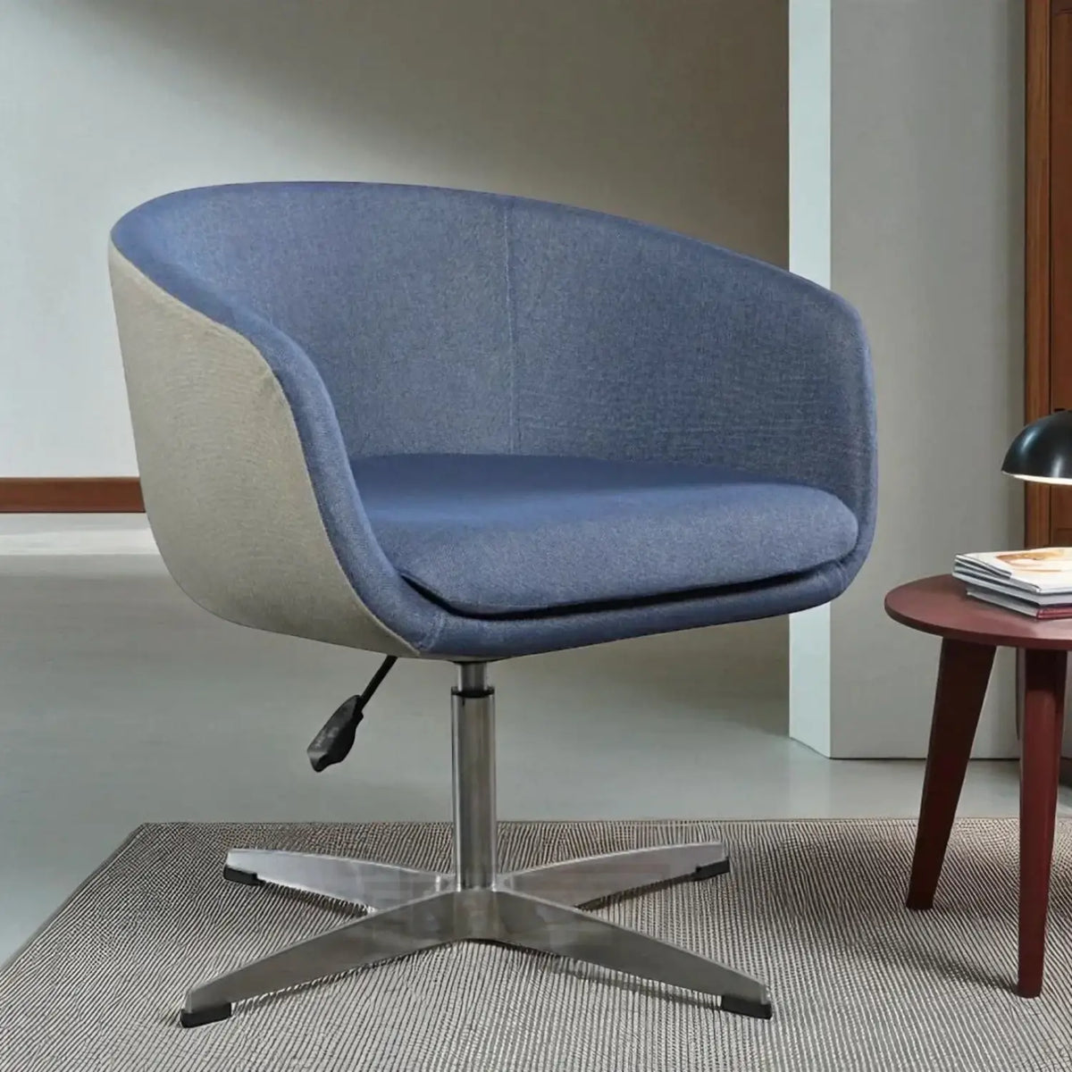 Blue and grey fabric swivel chair in a room with a small table and lamp.
