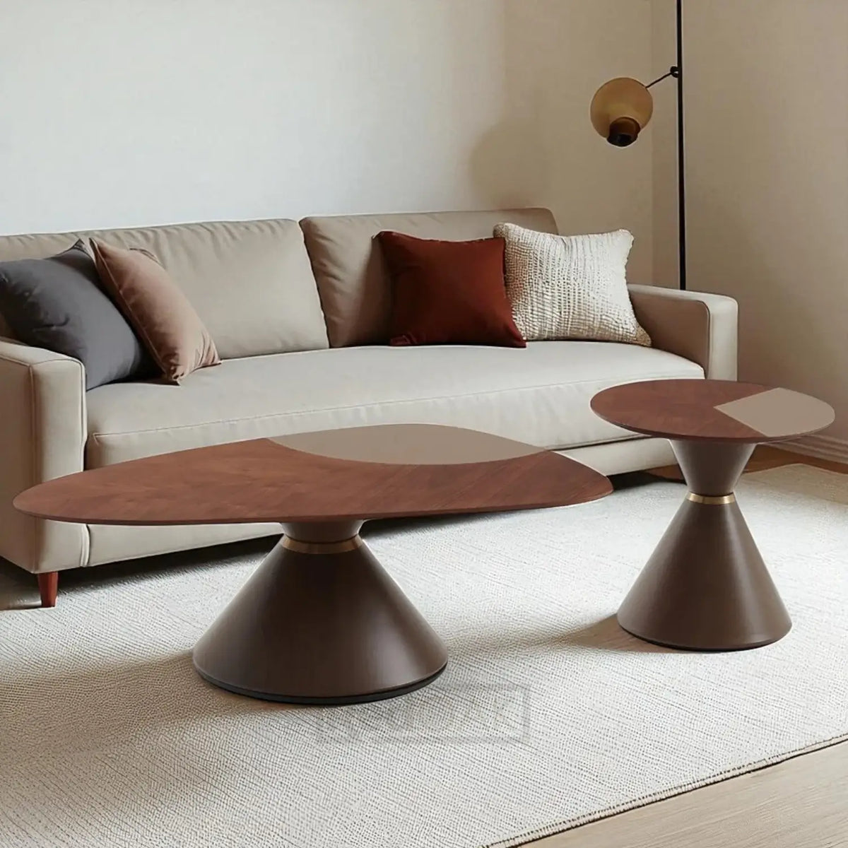 Modern living room with a beige sofa and two stylish coffee tables.