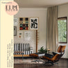 Modern living room with a striped sofa, wooden armchair, and abstract art on the wall. 'ELLE DECOR' logo is visible.