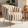 Striped armchair in a room with wooden furniture and decor