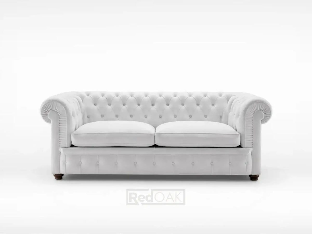 Gray tufted sofa on a white background