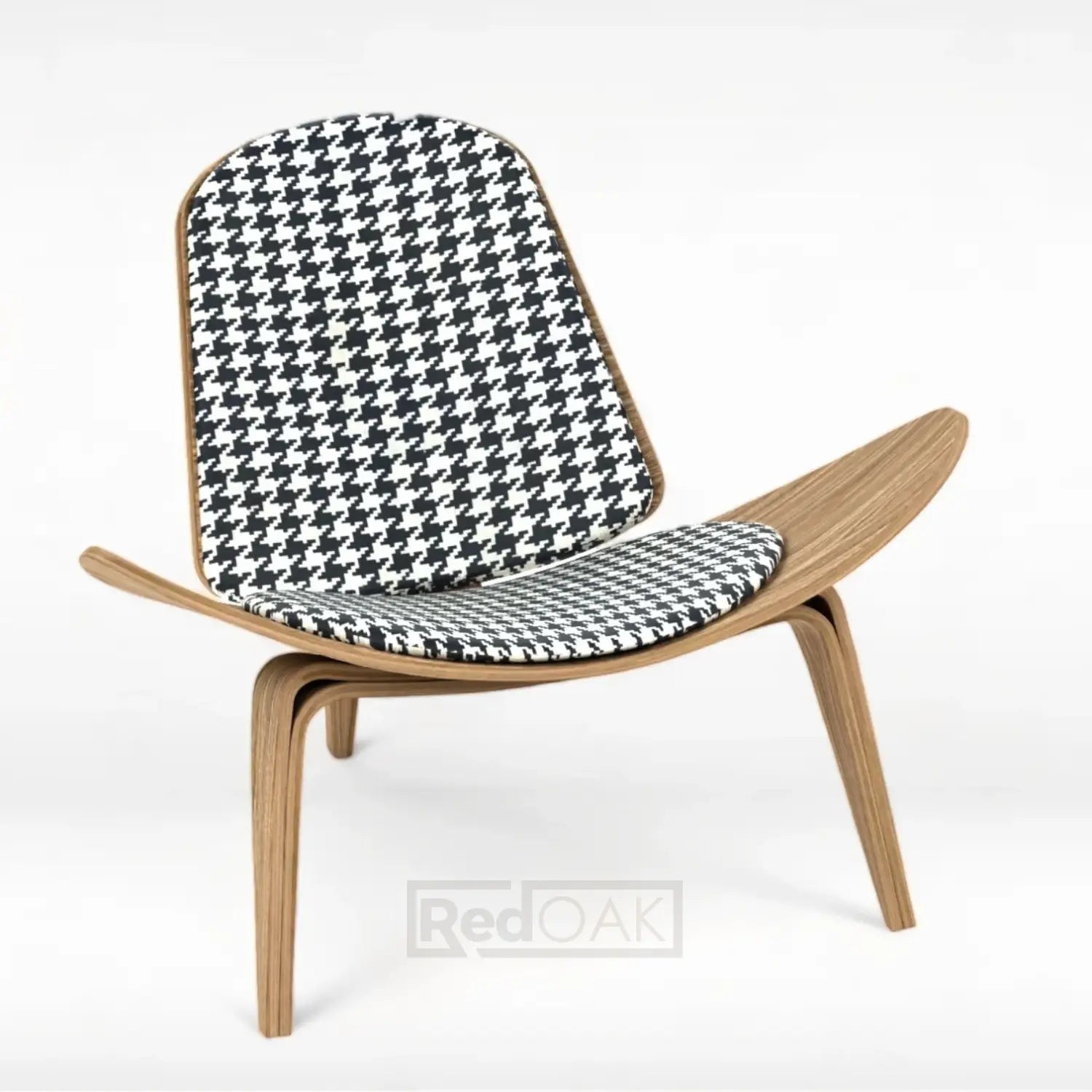 A modern shell chair with a brown wooden frame and a black and white checkered fabric seat and backrest.