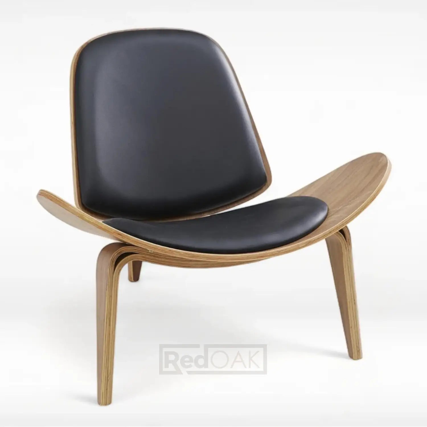 A modern lounge chair with a wooden frame and black upholstered seat, inspired by Hans Wegner's shell chair design.