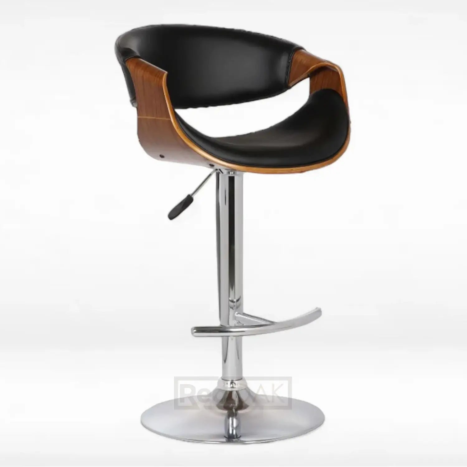 An elegant barstool with a curved seat and back pieces, featuring a black faux leather upholstery on the inside, a walnut finish on the back, and a metal pedestal base with adjustable height and swivel functionality.