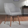 Gray upholstered chair with wooden legs in a room setting