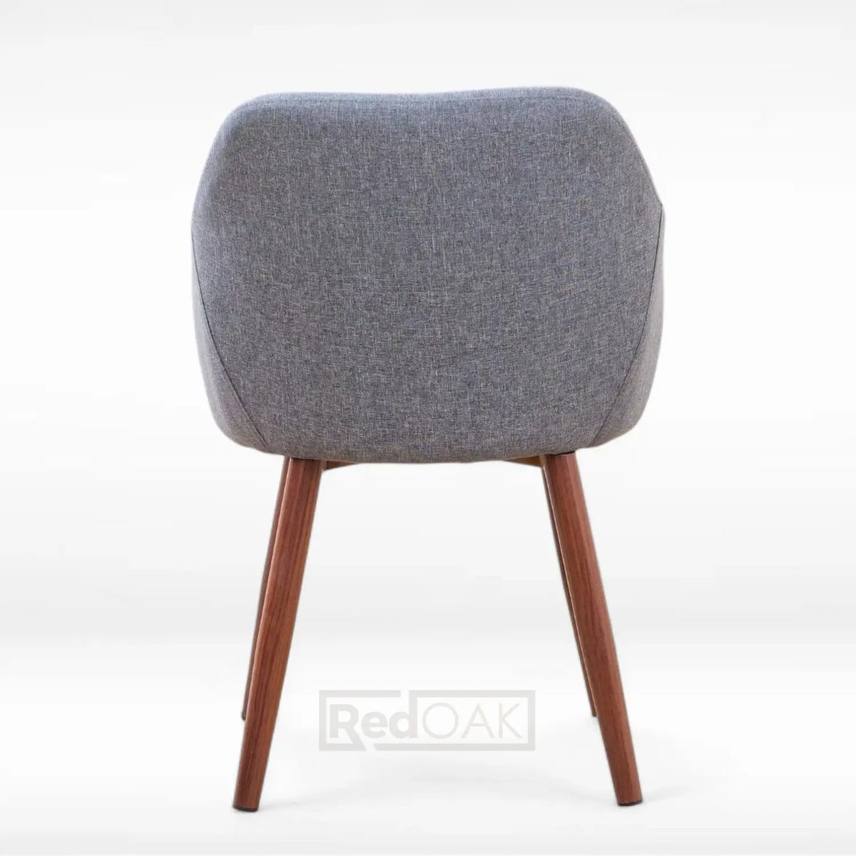 Gray upholstered chair with wooden legs on a white background