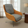 Modern chair with orange frame and gray cushion in a room with a lamp and table.