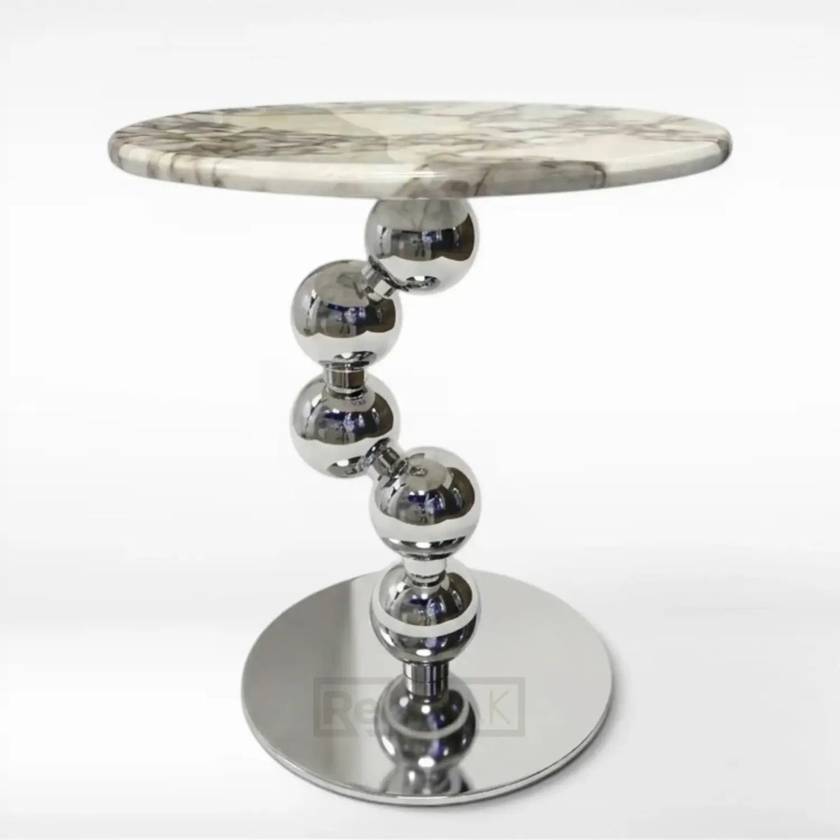 Side table with marble top and metallic base on a white background