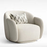 Beige armchair with a patterned pillow on a white background