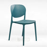 Teal chair with a perforated design on a white background