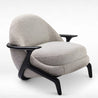 Modern armchair with beige cushioned seat and backrest on a white background