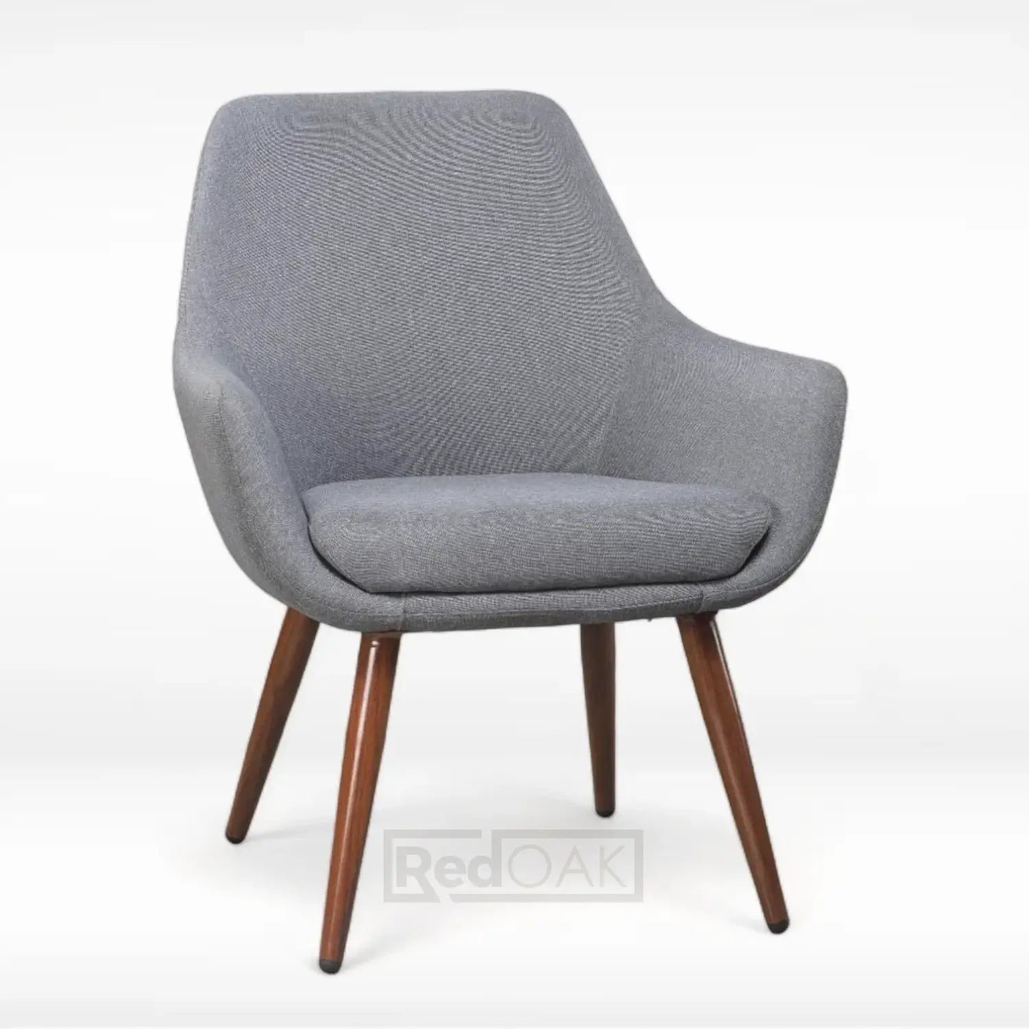 A modern slipper chair with metal legs in a wood finish and a cushioned seat and backrest in a gray fabric upholstery.