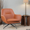 Orange armchair in a modern room with a wooden side table and lamp.