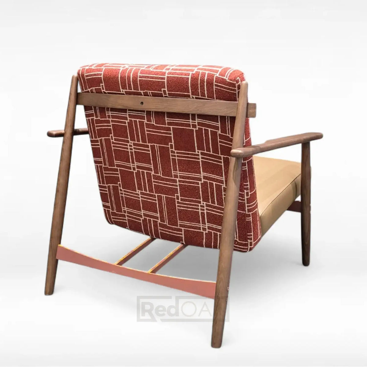 Chair with wooden frame and red patterned backrest on a white background