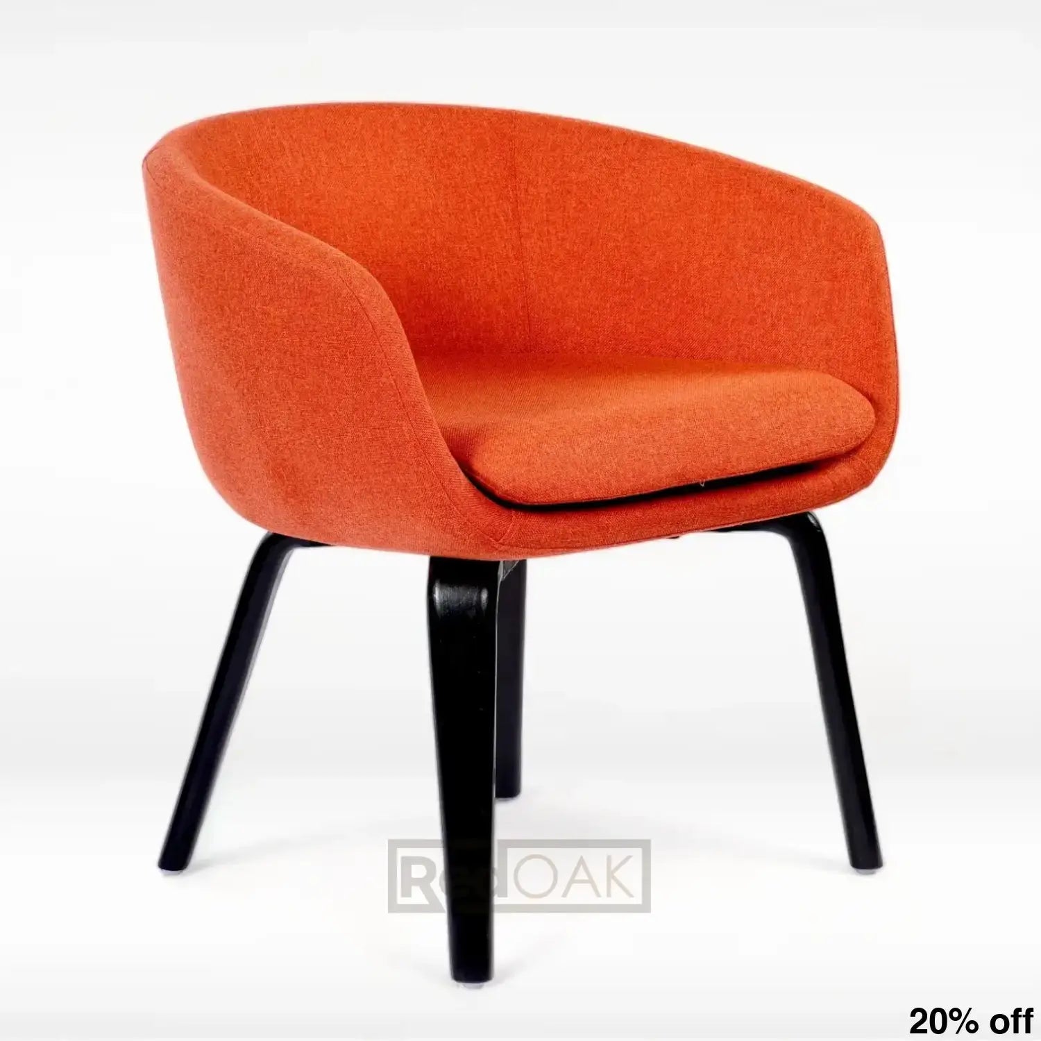 A modern orange lounge chair with a cushion and sturdy wooden legs.