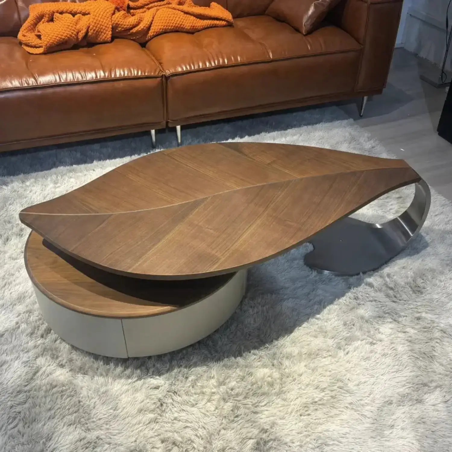 Modern coffee table with a unique design on a gray rug
