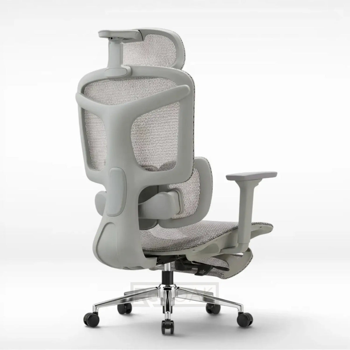 A light gray ergonomic office chair with a breathable mesh back, adjustable armrests, and a five-wheel base, shown from a three-quarter rear angle on a white studio background.