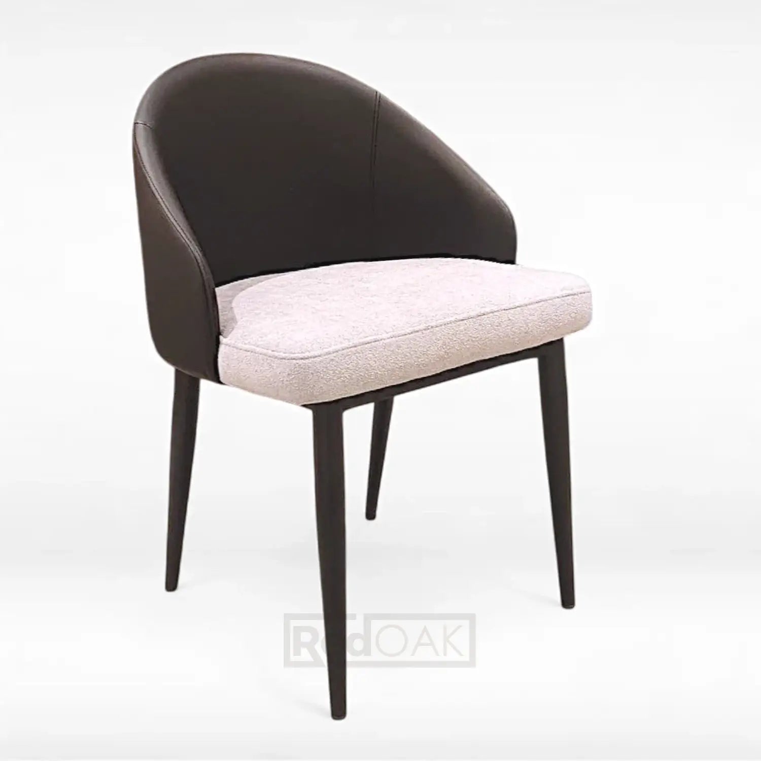 A modern dining chair with a high backrest and seat, featuring a combination of dark and light upholstery.