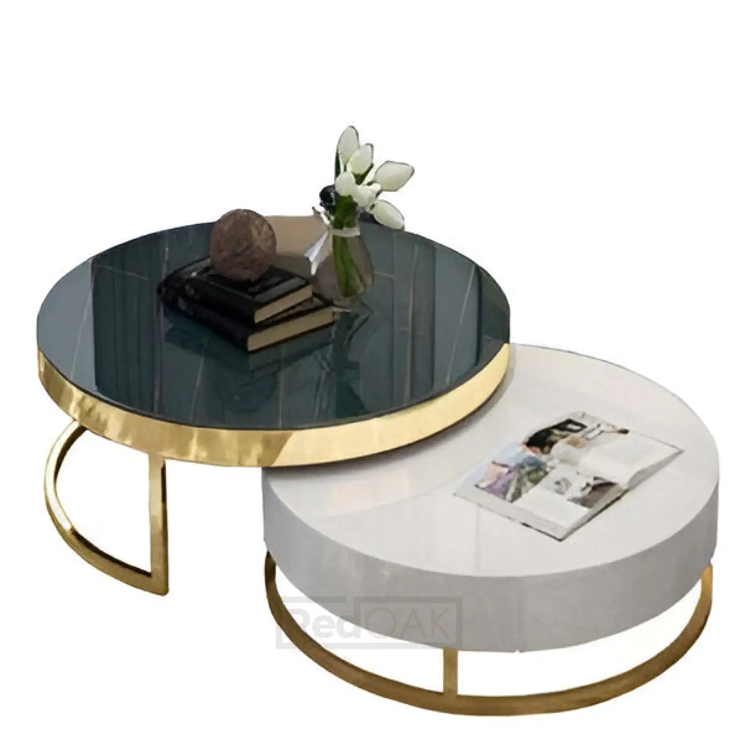 A set of two round tables with a gold metal base, one with a dark gray ceramic top and another with a light gray top, arranged one over the other.